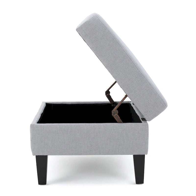 Otomano tapizado acolchado de almacenamiento de color gris claro con patas de madera de abedul
