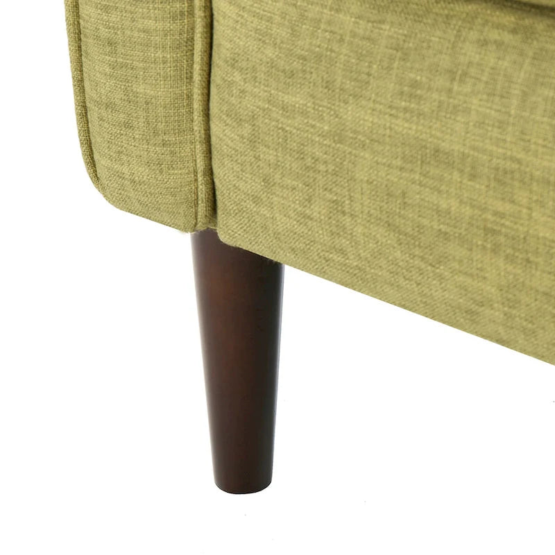 Groene stoffen gecapitonneerde relaxfauteuil met naar achteren te duwen rugleuning en taps toelopende poten van beukenhout