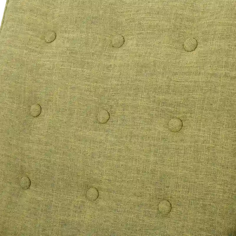 Groene stoffen gecapitonneerde relaxfauteuil met naar achteren te duwen rugleuning en taps toelopende poten van beukenhout