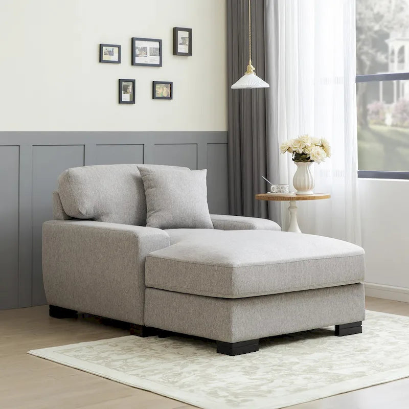 Chaise longue tapizada moderna con brazos acolchados y patas de madera