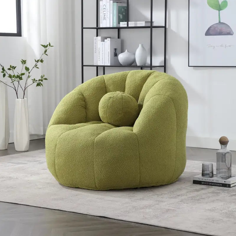 Sillón tipo puf redondo tapizado, de textura suave, para leer