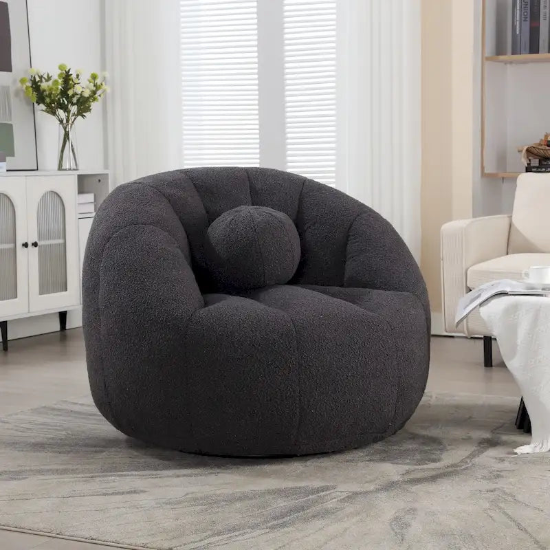 Sillón tipo puf redondo tapizado, de textura suave, para leer