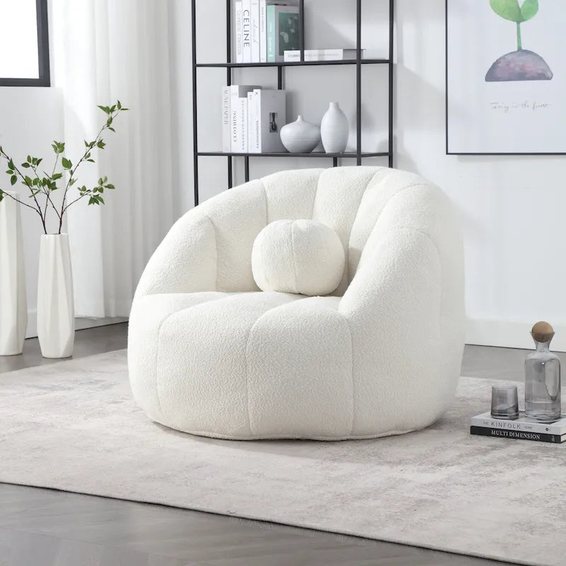 Sillón tipo puf redondo tapizado, de textura suave, para leer