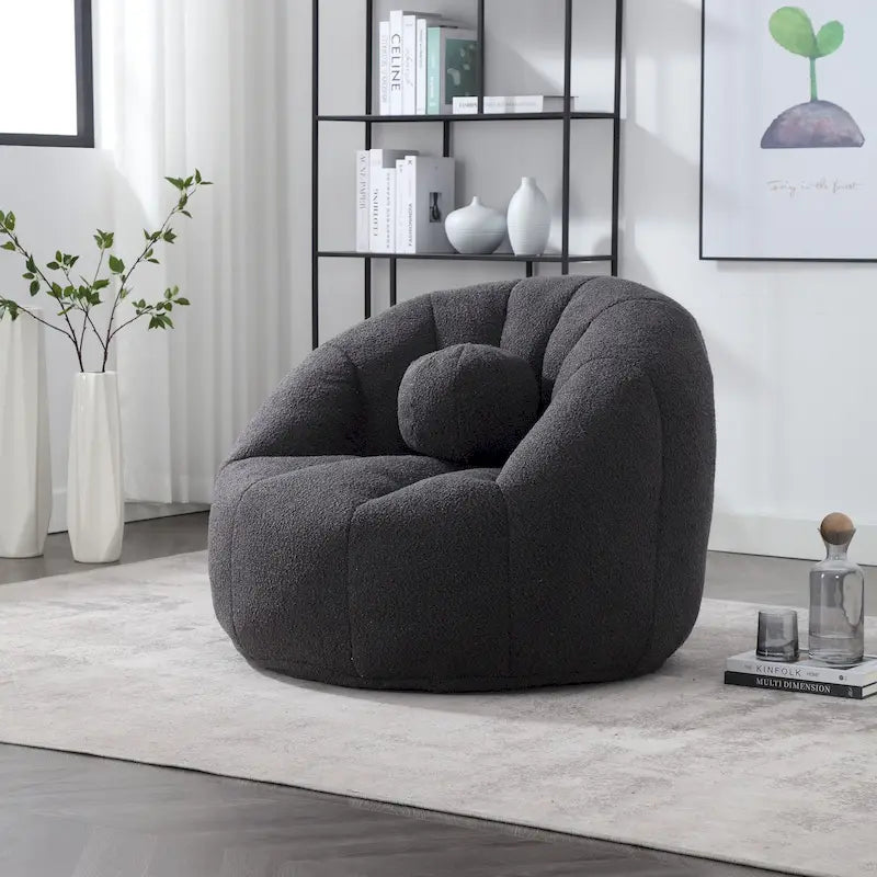 Sillón tipo puf redondo tapizado, de textura suave, para leer