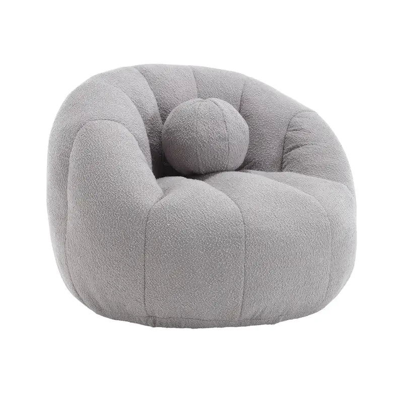 Sillón tipo puf redondo tapizado, de textura suave, para leer