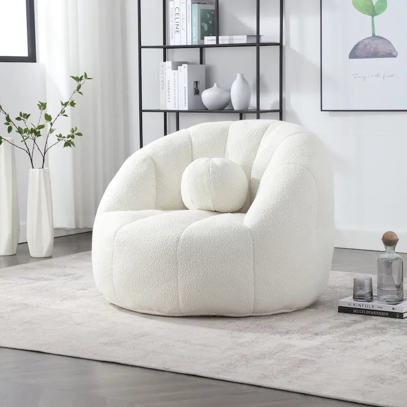 Sillón tipo puf redondo tapizado, de textura suave, para leer
