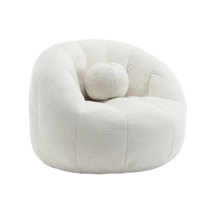 Sillón tipo puf redondo tapizado, de textura suave, para leer