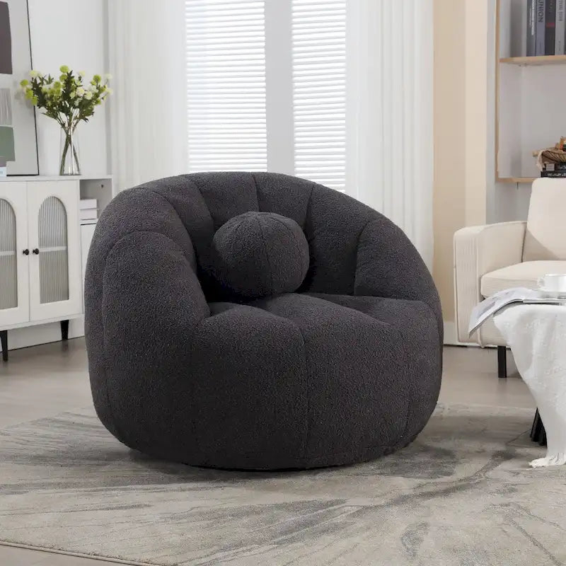 Sillón tipo puf redondo tapizado, de textura suave, para leer